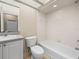 Bright bathroom featuring a bath tub, vanity, and tile flooring at 1507 Eagle Pond Dr # 1507, Winter Haven, FL 33884