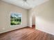 Bedroom with laminate flooring and a large window providing lots of light at 1507 Eagle Pond Dr # 1507, Winter Haven, FL 33884