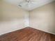 Empty bedroom featuring dark wood flooring, ceiling fan, and neutral walls at 1507 Eagle Pond Dr # 1507, Winter Haven, FL 33884
