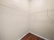 Walk-in closet with a wire shelving system and wood-look flooring at 1507 Eagle Pond Dr # 1507, Winter Haven, FL 33884