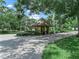 Neighborhood guard house surrounded by lush greenery at 1507 Eagle Pond Dr # 1507, Winter Haven, FL 33884