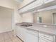 Kitchen featuring stainless steel sink, dishwasher, and white cabinets at 1507 Eagle Pond Dr # 1507, Winter Haven, FL 33884