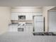 Well-lit kitchen featuring white appliances, cabinets and laminate countertop at 1507 Eagle Pond Dr # 1507, Winter Haven, FL 33884