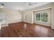 Spacious living room featuring natural light and dark wood flooring at 1507 Eagle Pond Dr # 1507, Winter Haven, FL 33884