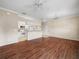 Open floor plan featuring kitchen and living room with dark wood flooring at 1507 Eagle Pond Dr # 1507, Winter Haven, FL 33884