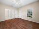 Main bedroom featuring natural light, dark wood flooring, and ensuite bathroom at 1507 Eagle Pond Dr # 1507, Winter Haven, FL 33884