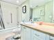 Well-lit bathroom with a vanity, tub/shower combo, and neutral color scheme at 1776 6Th Street Nw # 709, Winter Haven, FL 33881