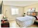 Comfortable bedroom featuring a queen bed, window for natural light, and decorative accents at 1776 6Th Street Nw # 709, Winter Haven, FL 33881