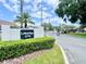 Lakeridge gated community entrance featuring a stone sign, lush landscaping, and secure access for residents at 1776 6Th Street Nw # 709, Winter Haven, FL 33881