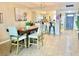 Inviting dining room with seating for four and open access to the kitchen at 1776 6Th Street Nw # 709, Winter Haven, FL 33881