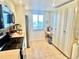 Bright kitchen with stainless steel appliances, tile floors, and pantry with ample cabinet storage at 1776 6Th Street Nw # 709, Winter Haven, FL 33881