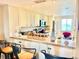 A kitchen with an island, stainless steel appliances, granite countertops, and a breakfast bar at 1776 6Th Street Nw # 709, Winter Haven, FL 33881