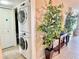 Convenient in-unit laundry area with stacked washer and dryer, surrounded by decor at 1776 6Th Street Nw # 709, Winter Haven, FL 33881