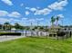 Community pool with lounge chairs and a gazebo, perfect for relaxation and outdoor enjoyment at 1776 6Th Street Nw # 709, Winter Haven, FL 33881