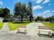 Community shuffleboard court surrounded by lush green lawns and mature trees at 1776 6Th Street Nw # 709, Winter Haven, FL 33881