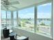 Bright sunroom with a scenic view from the large picture window and comfortable wicker seating at 1776 6Th Street Nw # 709, Winter Haven, FL 33881