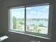Scenic view of the lake and city buildings through a large window at 1776 6Th Street Nw # 709, Winter Haven, FL 33881