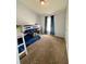 This bedroom features a bunk bed, dresser, and carpeted floors at 1790 Turtle Rock Dr, Lakeland, FL 33803