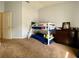 This bedroom features a bunk bed, dresser, and carpeted floors at 1790 Turtle Rock Dr, Lakeland, FL 33803