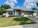 Charming one-story home with a well-maintained lawn, fresh landscaping, and a neutral color scheme at 1790 Turtle Rock Dr, Lakeland, FL 33803