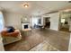 Open-concept living room and dining area featuring neutral tones, a fireplace, and plenty of natural light at 1790 Turtle Rock Dr, Lakeland, FL 33803