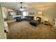 Comfortable living room with a large sofa, ceiling fan, and open-concept design at 1790 Turtle Rock Dr, Lakeland, FL 33803