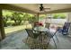 Relaxing screened porch with ceiling fan, comfortable seating, stylish rug, and backyard view at 1790 Turtle Rock Dr, Lakeland, FL 33803