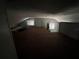 Spacious attic featuring two windows and unique architectural details at 1805 S Lake Reedy Blvd, Frostproof, FL 33843