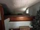 Attic with built-in platform, wood trim, and natural light from a window at 1805 S Lake Reedy Blvd, Frostproof, FL 33843