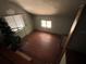 Attic space with natural light from two windows and hardwood floors at 1805 S Lake Reedy Blvd, Frostproof, FL 33843