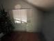 Attic space with a window and classic architectural details at 1805 S Lake Reedy Blvd, Frostproof, FL 33843