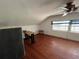 Bedroom with hardwood floors, a ceiling fan, and a window at 1805 S Lake Reedy Blvd, Frostproof, FL 33843