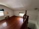 Bedroom featuring hardwood floors and two windows at 1805 S Lake Reedy Blvd, Frostproof, FL 33843