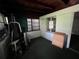 Enclosed porch with wooden ceilings, windows, and exercise equipment at 1805 S Lake Reedy Blvd, Frostproof, FL 33843