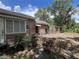 Exterior view showcasing a home with a covered entrance and shuttered windows surrounded by foliage at 1805 S Lake Reedy Blvd, Frostproof, FL 33843