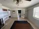 Bright living room featuring tiled floors and a decorative fireplace at 1805 S Lake Reedy Blvd, Frostproof, FL 33843