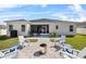 Spacious backyard featuring a patio with a barbecue grill and outdoor seating area, perfect for relaxation and entertainment at 185 St Thomas Dr, Mulberry, FL 33860