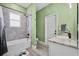 Bathroom featuring a tub with shower, and a single sink vanity with stone counter at 185 St Thomas Dr, Mulberry, FL 33860