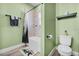 Bright bathroom featuring a shower-tub combo and efficient toilet design at 185 St Thomas Dr, Mulberry, FL 33860