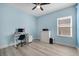 Bedroom featuring a workspace with sleek desk, chair, and a bright window view at 185 St Thomas Dr, Mulberry, FL 33860