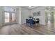 Dining Room features hard-surface floors, natural light from the front door, and an open floor plan at 185 St Thomas Dr, Mulberry, FL 33860