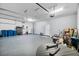 Spacious garage with ample storage and workspace, featuring bright lighting and a clean, organized layout at 185 St Thomas Dr, Mulberry, FL 33860