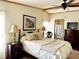 Relaxing bedroom showcasing a comfortable bed, ceiling fan, and tasteful decor at 1976 Holy Cow Rd, Polk City, FL 33868
