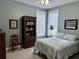 Relax in this bedroom with a decorative bookcase, neutral walls, and carpet floors at 1976 Holy Cow Rd, Polk City, FL 33868