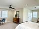 Bedroom featuring a wooden dresser, a ceiling fan, carpet flooring, and plenty of natural light at 1976 Holy Cow Rd, Polk City, FL 33868