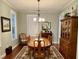 Formal dining room with a wood table set for a meal at 1976 Holy Cow Rd, Polk City, FL 33868