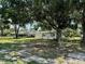 Spacious lot featuring two separate houses, mature trees, and lush green grass at 1976 Holy Cow Rd, Polk City, FL 33868