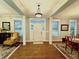Inviting foyer with hardwood floors, natural light, and classic design elements at 1976 Holy Cow Rd, Polk City, FL 33868