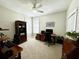 This home office offers an organized workspace with built-in shelving and ample natural light at 1976 Holy Cow Rd, Polk City, FL 33868
