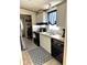 Well-lit kitchen featuring updated appliances and fixtures at 1976 Holy Cow Rd, Polk City, FL 33868